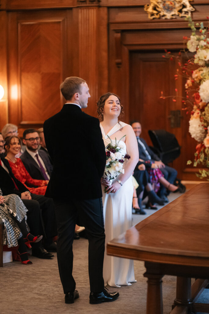 sharing vows during intimate ceremony in the westminster room at the old marylebone town hall 