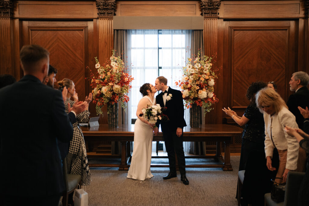 first kiss during intimate ceremony in the westminster room at the old marylebone town hall 
