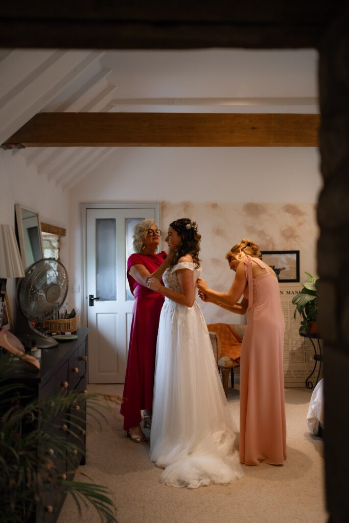 flora getting ready in dress