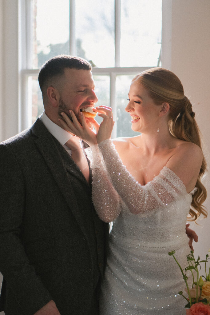 bride and groom eating cake