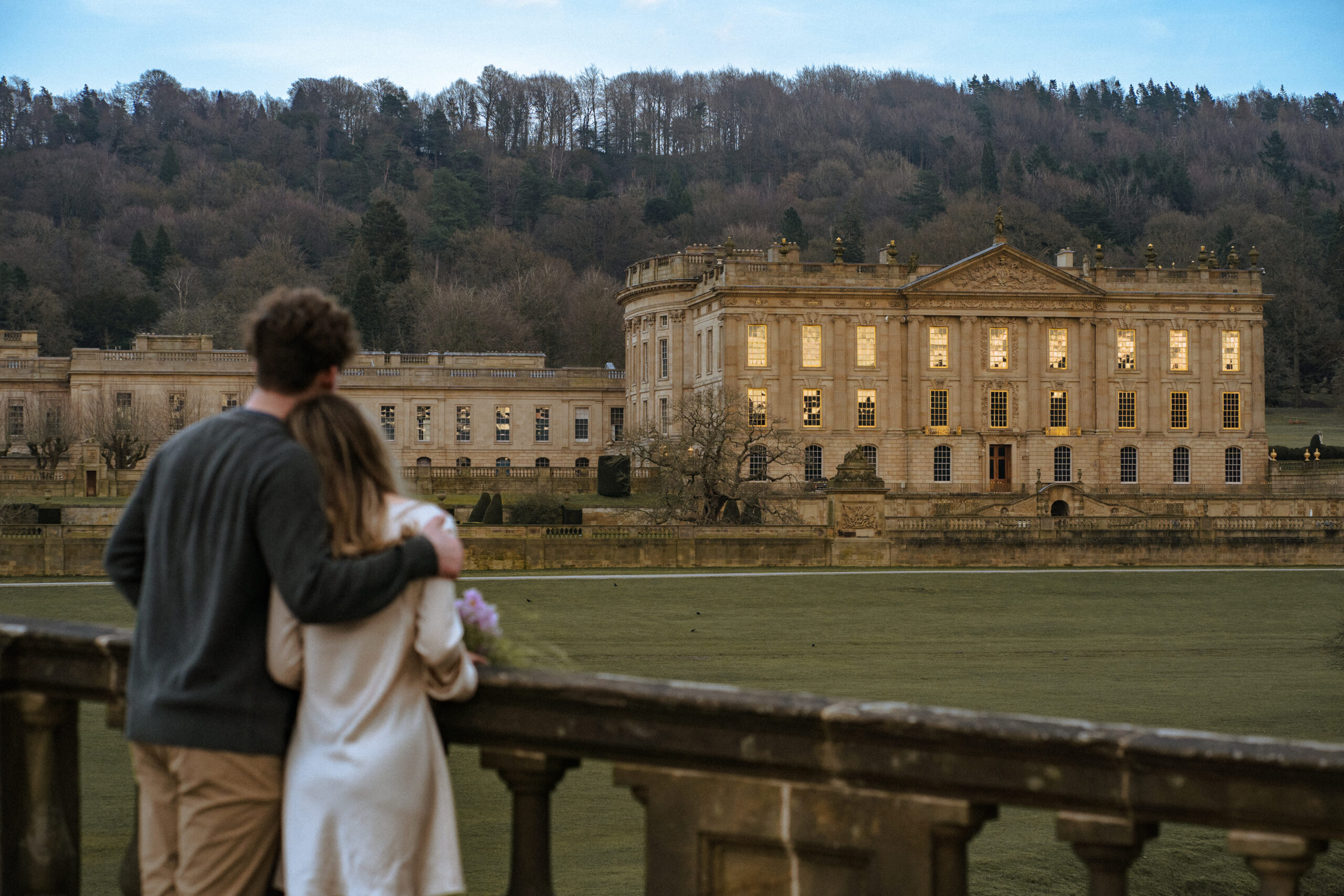 couple engaged infront of chatsworth house