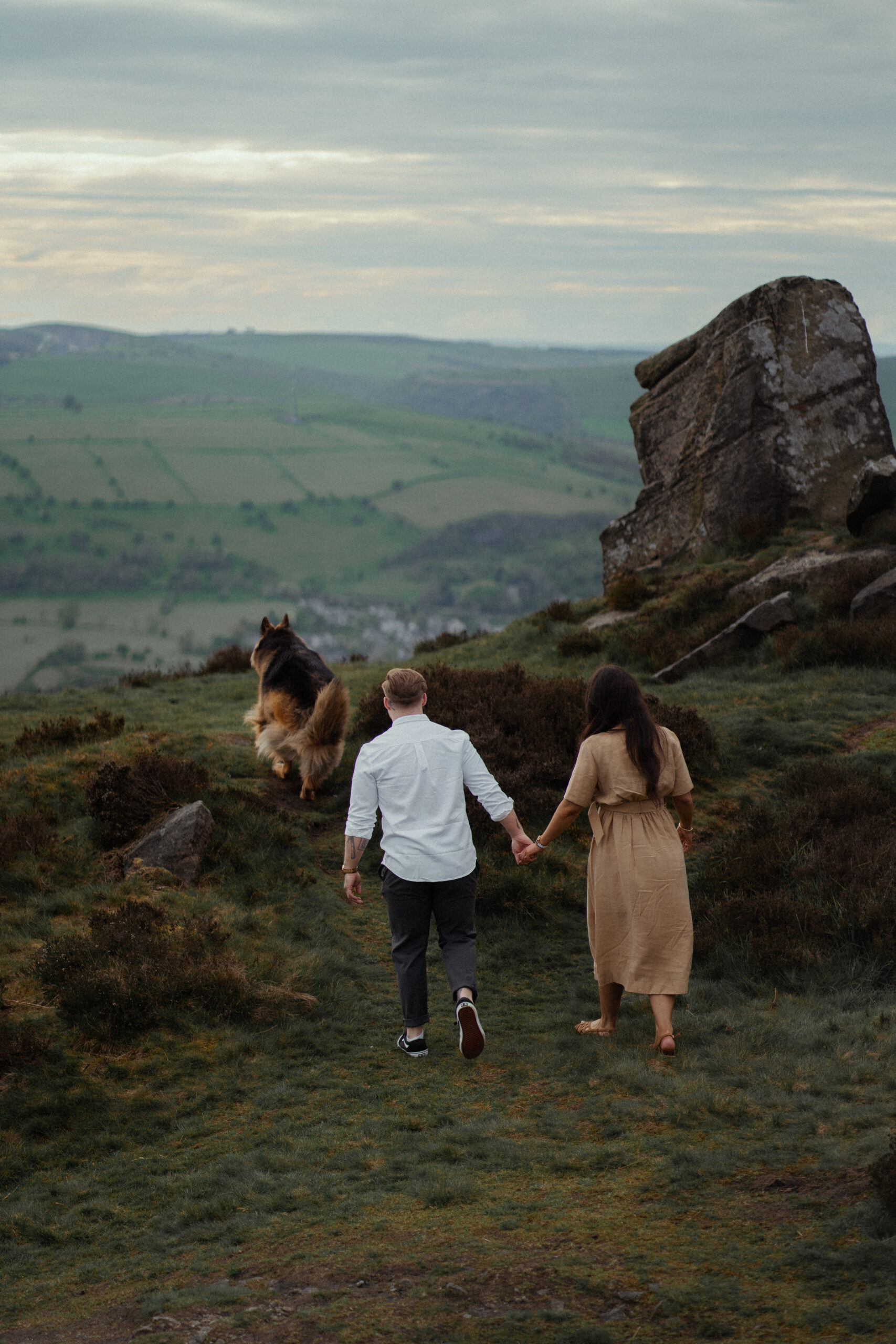 rosie, jake and buddy the dog walking to look at the views from curbar edge 