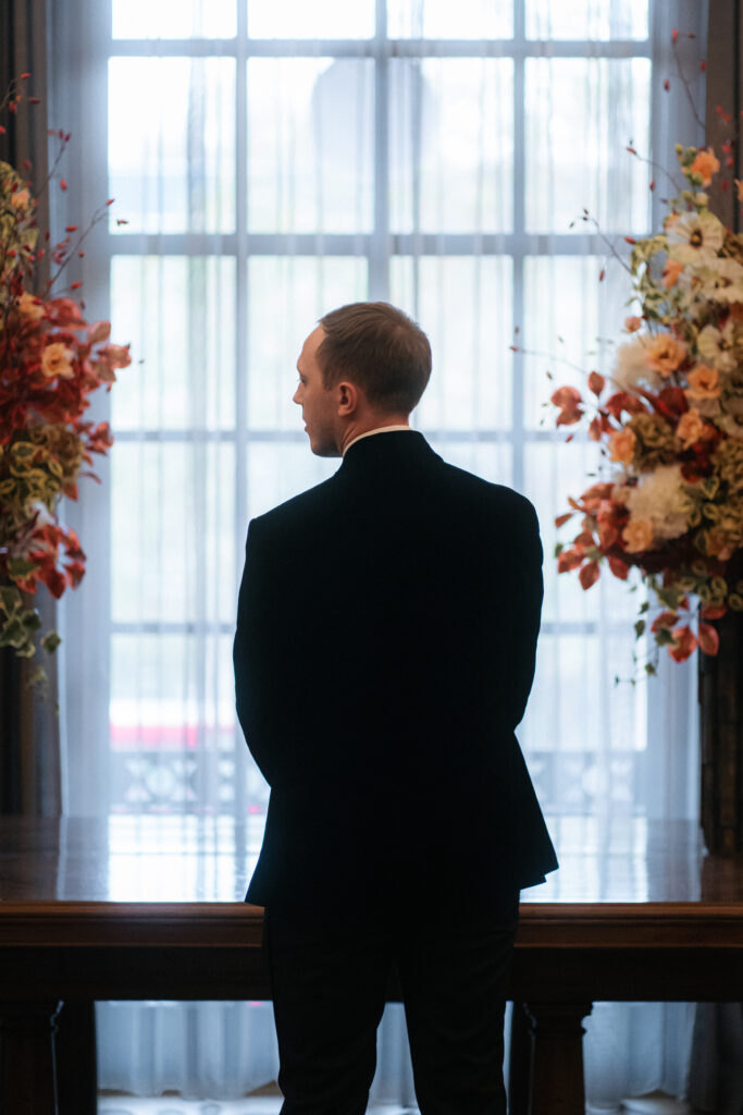 groom waiting at alter