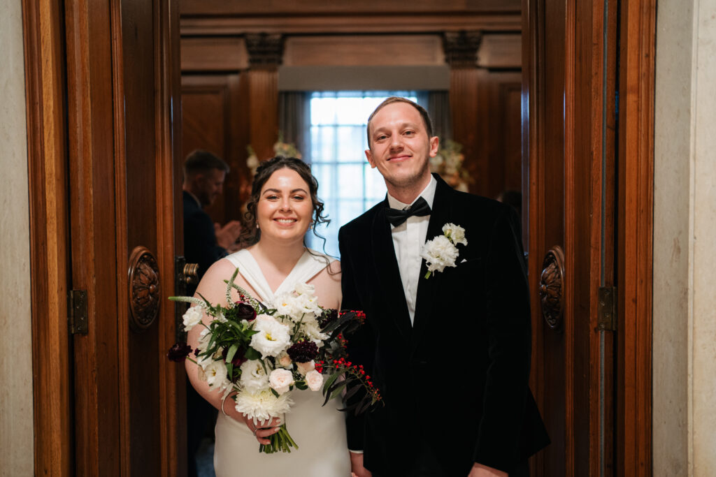 bride and groom portrait leaving the westminster room in the old marylebone town hall