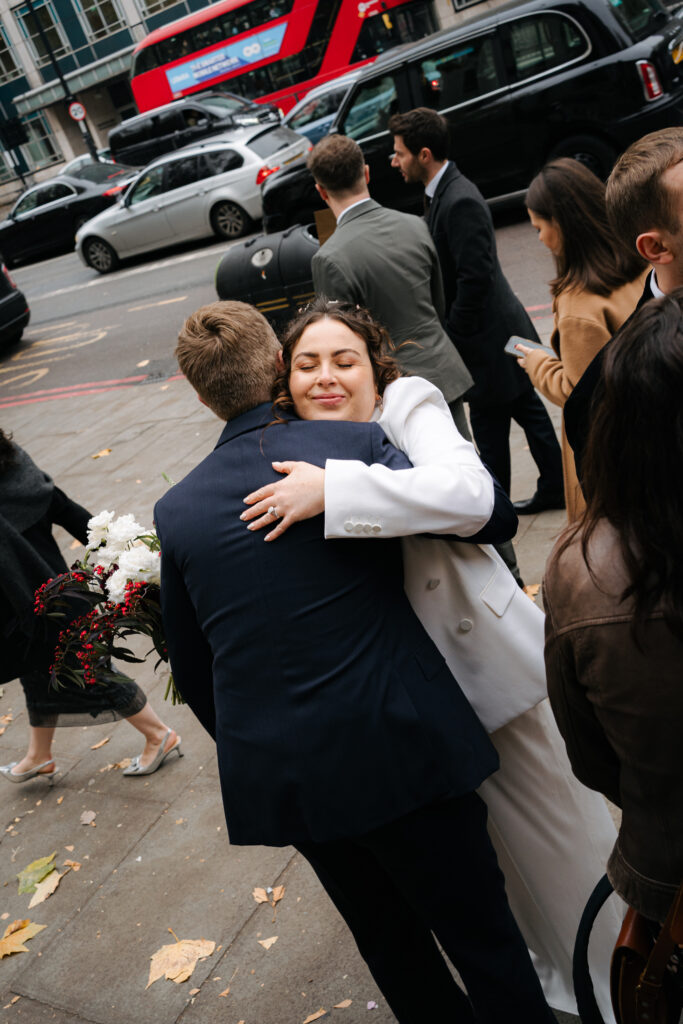 bride hugging guests