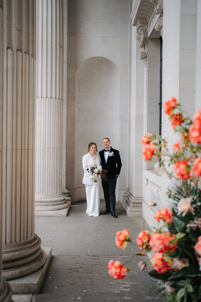 bride and groom portraits outside old marylebone town hall in london