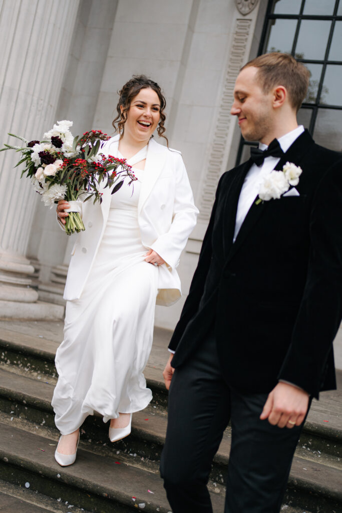 bride and groom portraits outside old marylebone town hall in london