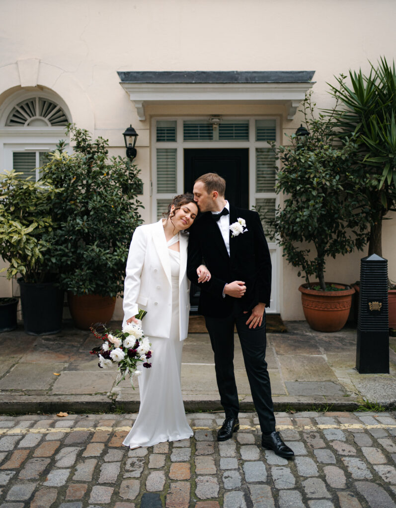 bride and groom portraits outside old marylebone town hall in london