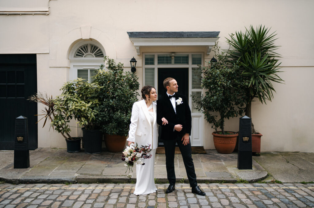 bride and groom portraits outside old marylebone town hall in london