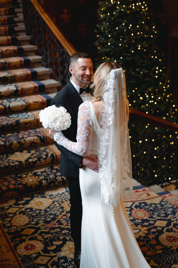 first look with groom on the grand staircase at St Pancras Renaissance Hotel 