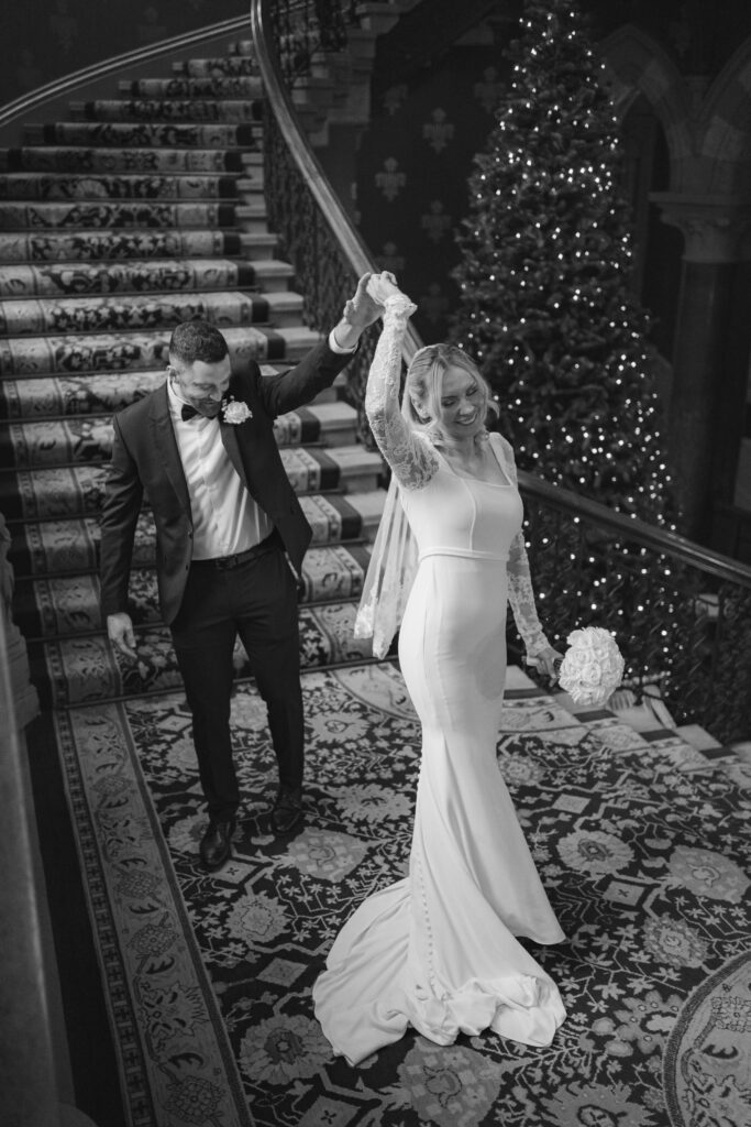 first look with groom on the grand staircase at St Pancras Renaissance Hotel 