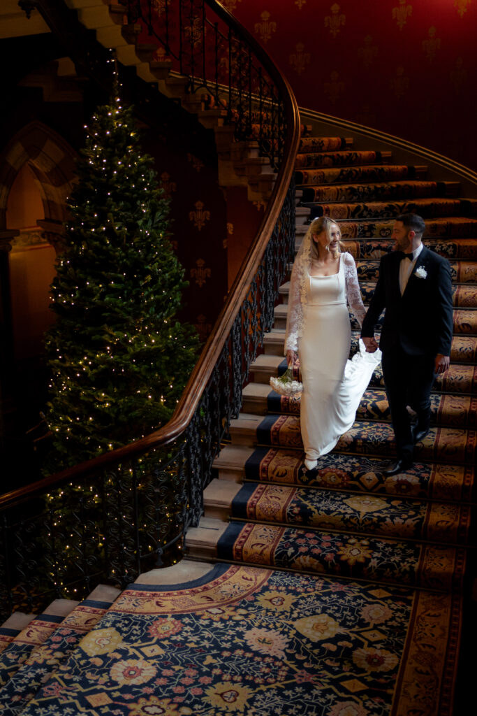 couple portraits on the grand staircase at St Pancras Renaissance Hotel 