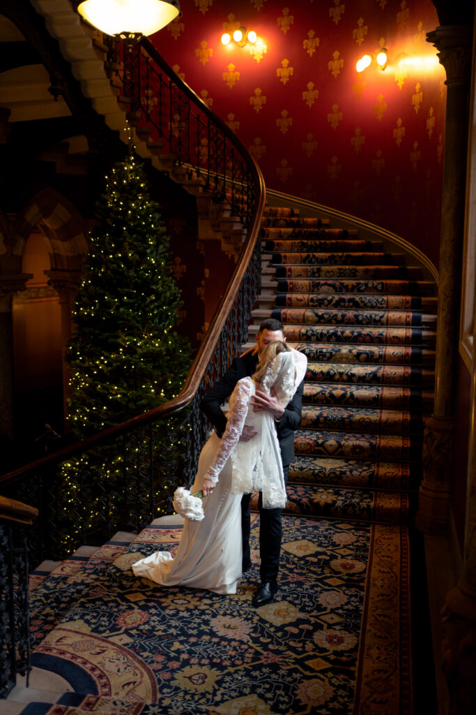 couple portraits on the grand staircase at St Pancras Renaissance Hotel 