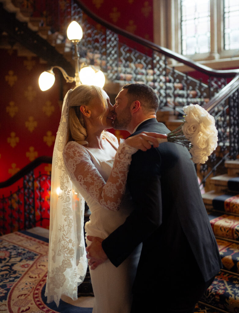 couple portraits on the grand staircase at St Pancras Renaissance Hotel 