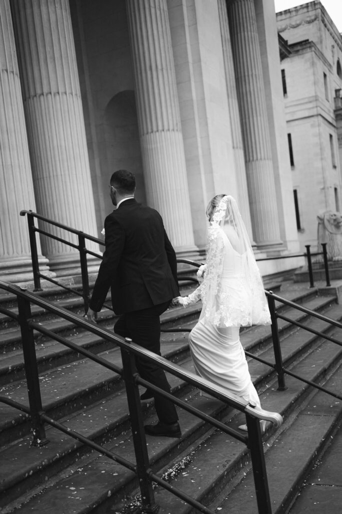 Bride and Groom portraits on steps outside Old Marylebone Town Hall