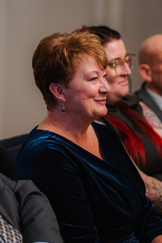 Guest reactions during elopement ceremony in the Soho Room at Old Marylebone Town Hall