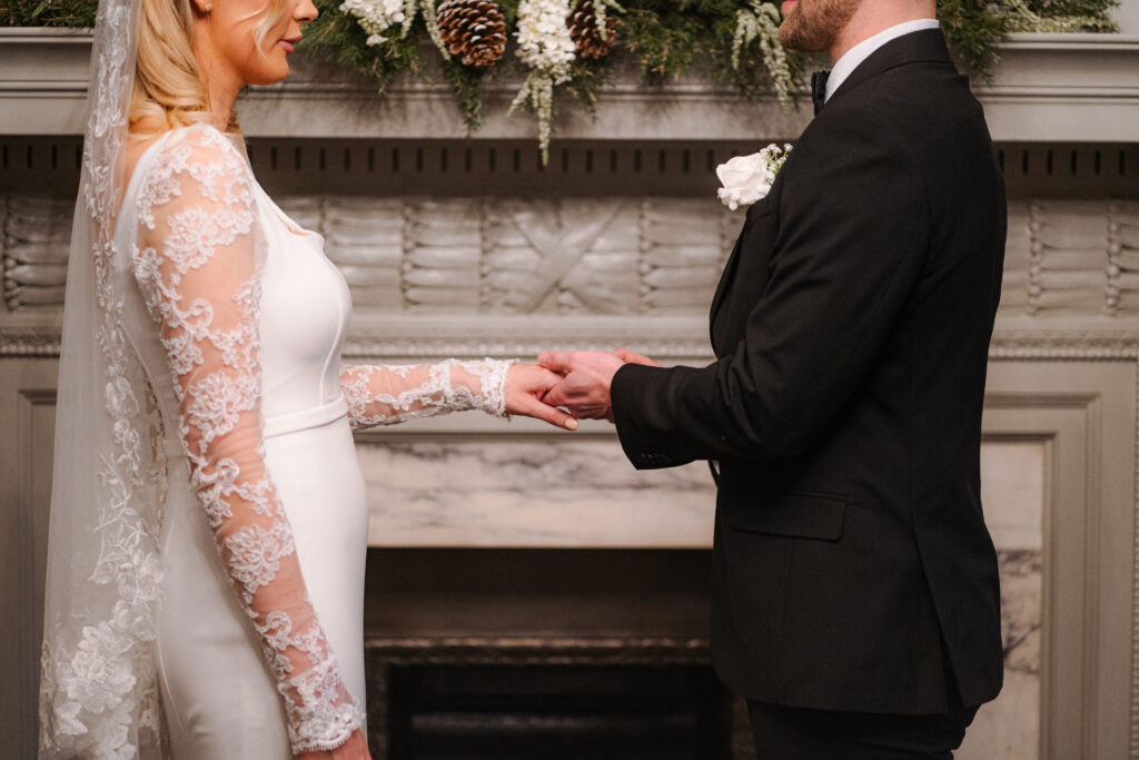 bride and groom wearing rings