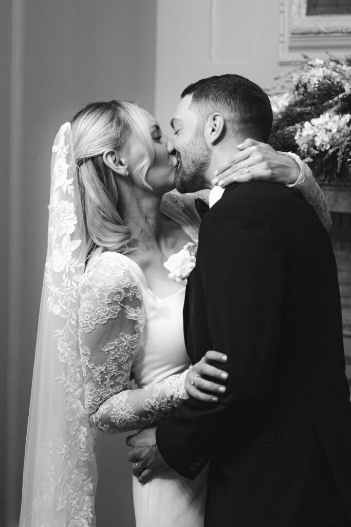 bride and groom first kiss during elopement ceremony