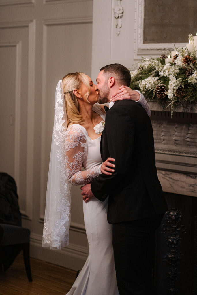 bride and groom first kiss during elopement ceremony