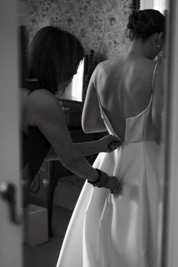 zipping up the dress