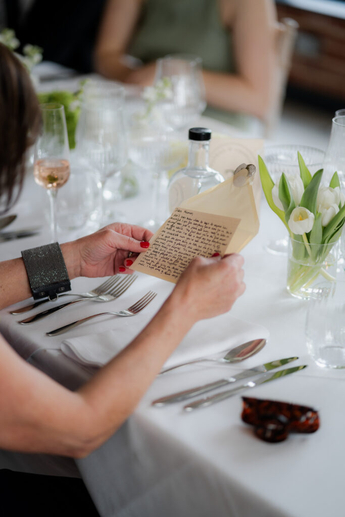 reading hand written letter during wedding breakfast