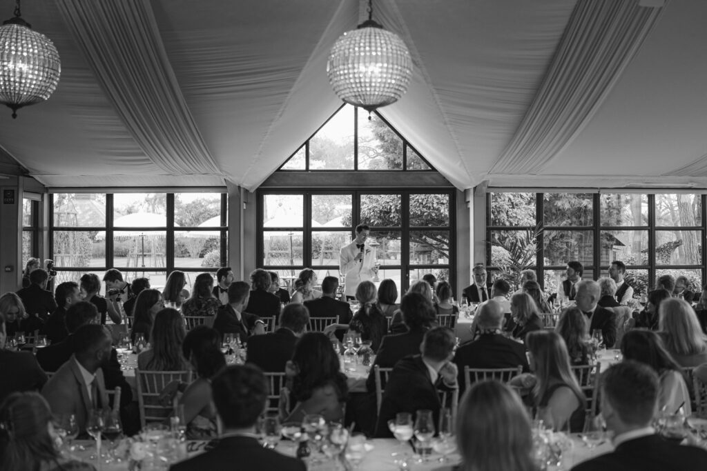 groom delivering a speech in the orangery at baddow park house