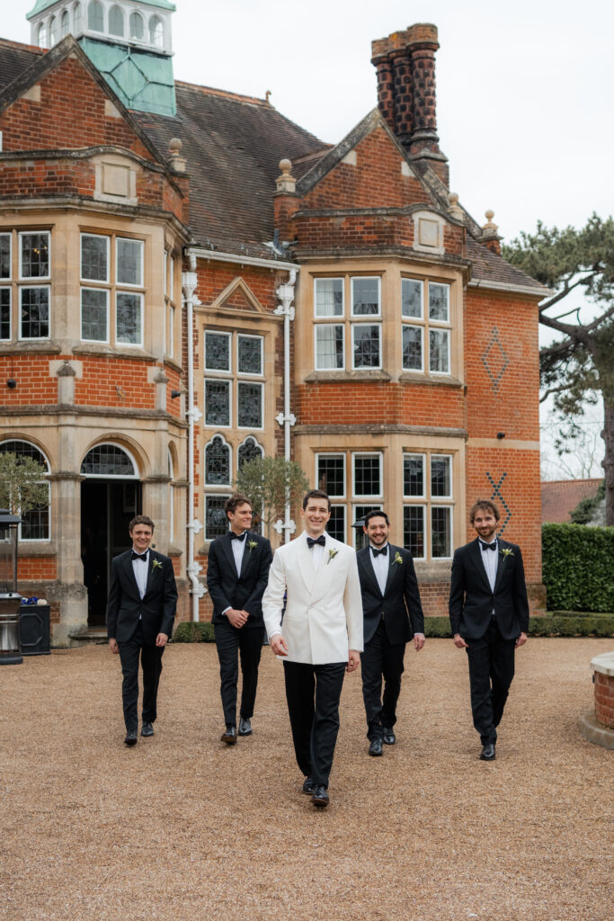 jonathan and groomsmen walking