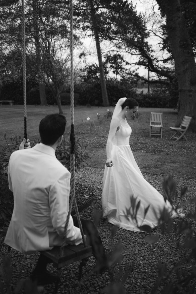 bride and groom portraits on swing at baddow park house during spring wedding