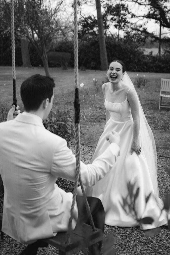 bride and groom portraits on swing at baddow park house during spring wedding
